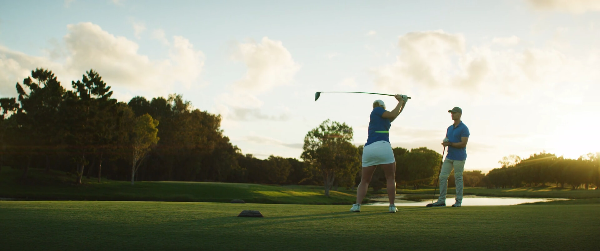 Men and women in a golf scramble team